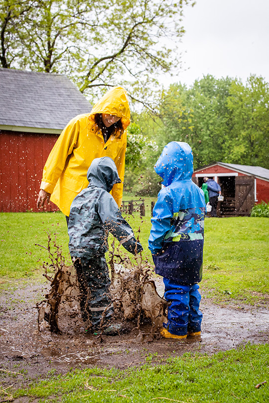 Jenny and children stomping in mud